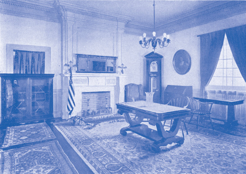 On the walls hang oil portraits of two Presidents General, Mrs. Charles W. Fairbanks and Mrs. Donald McLean, presented to the Society by their Friends. Mrs. Hawkins, Regent of the Caroline Scott Harrison Chapter, presented the silk flag and the Daughters of the American Revolution standard. Mr. and Mrs. Williard T. Block. Of Chicago presented the large tiger skin rug seen in front of the fireplace.