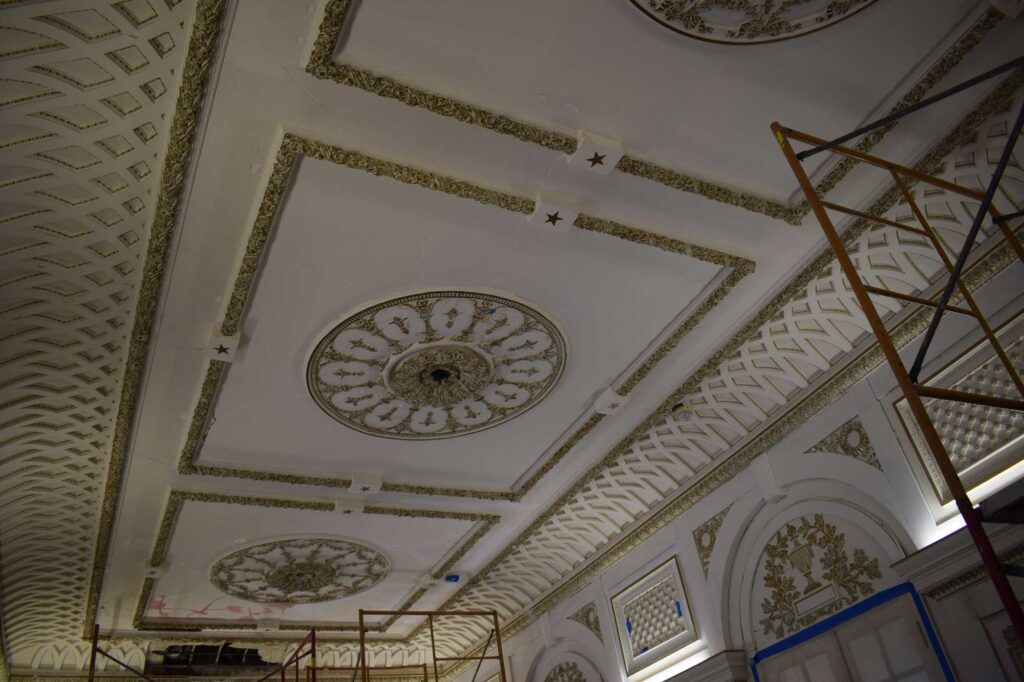 In this photo the yellowed paint and the brown, once gold, highlights can be seen.