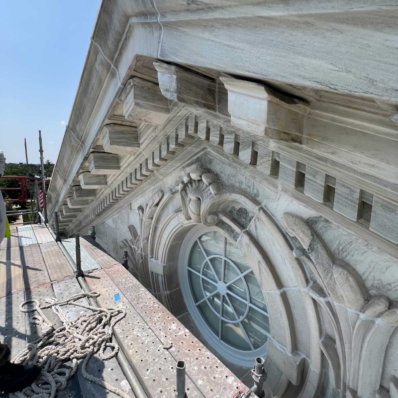 The pediment after cleaning. The stones were cleaned with plain water under low pressure. Also note the new mortar joints.